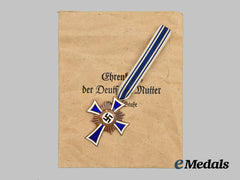 Germany, Third Reich. An Honour Cross of the German Mother, in Bronze, with its Packet of Issue by Gottlieb Friedrich Keck & Sohn