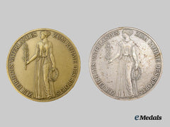 Germany, Third Reich. A Pair of 1936 Berlin Olympics Commemorative Medallions, Bronze and Silver Grades