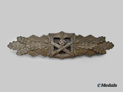 Germany, Wehrmacht. A Close Combat Clasp, Bronze Grade, by Arbeitsgemeinschaft Metall und Kunststoff