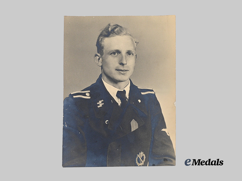 germany,_s_s._a_large_studio_portrait_of_a_decorated_waffen-_s_s_panzer_troops_unterscharführer_e_medals__g63018_2