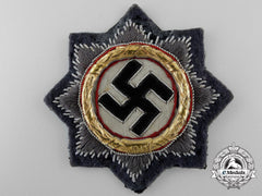 A Luftwaffe Issue German Cross In Gold; Cloth Version