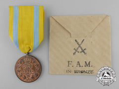 A Mint Saxon Friedrich August Medal; Bronze Grade With Packet