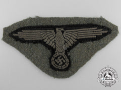 An Ss Em/Nco's Sleeve Eagle With Piece Of Tunic