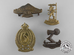 Four First War New Zealand Cap Badges