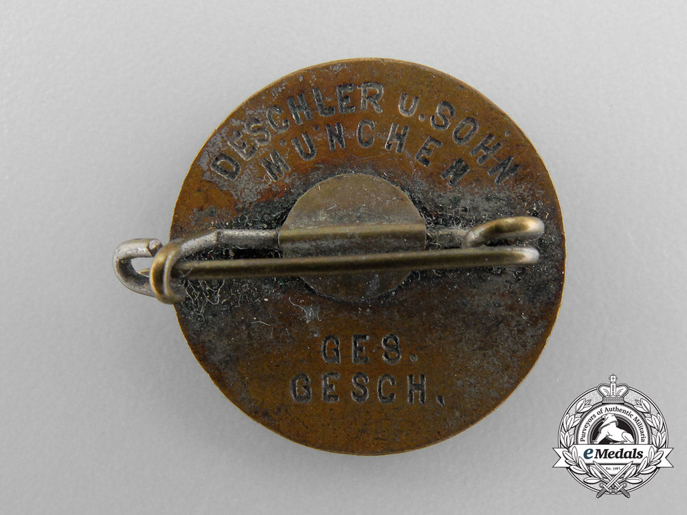 an_nsdap_party_badge,_by_deschler_a_6385