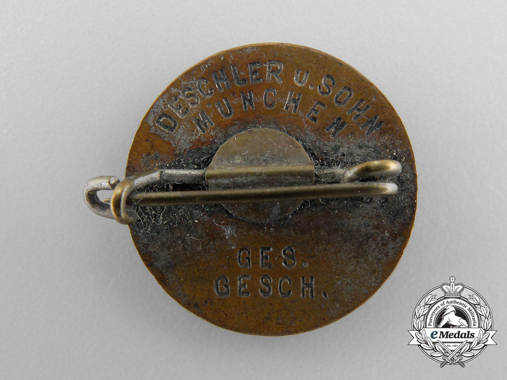 an_nsdap_party_badge,_by_deschler_a_6385