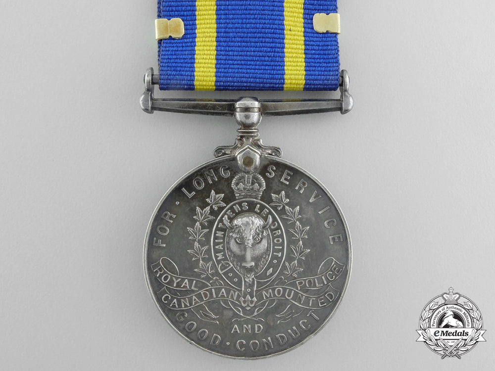 a_royal_canadian_mounted_police_long_service_medal_with_three_star_clasp_a_699