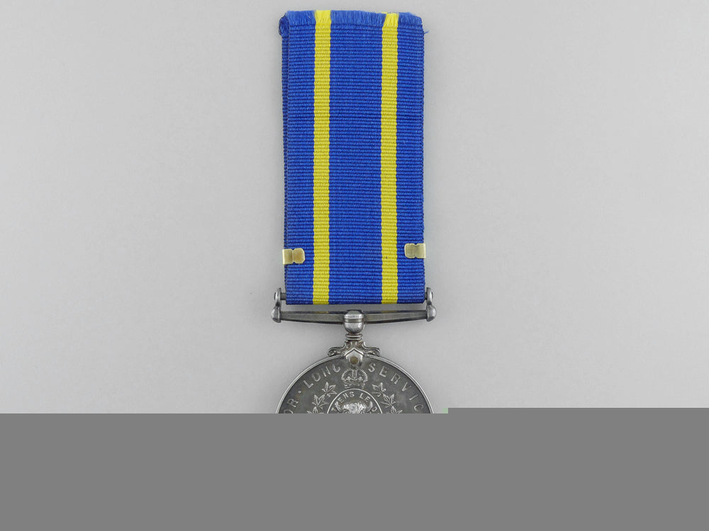 a_royal_canadian_mounted_police_long_service_medal_with_three_star_clasp_a_700