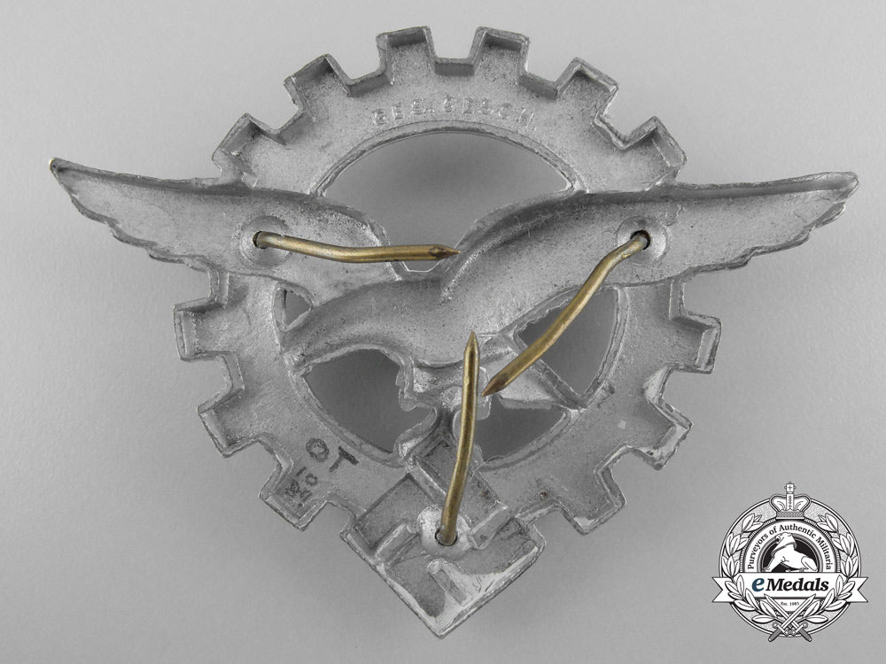 a_generalluftzeugmeister(_civilian_technician's)_officers's_visor_cap_insignia_a_9391