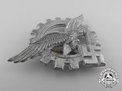 a_generalluftzeugmeister(_civilian_technician's)_officers's_visor_cap_insignia_a_9392