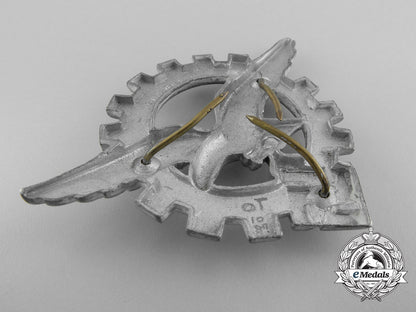 a_generalluftzeugmeister(_civilian_technician's)_officers's_visor_cap_insignia_a_9393