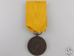 Netherlands. A Dutch Army Long Service Medal, Bronze Grade For 12 Service In The Colonies