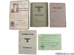 A Family Group Of Identification And Documents