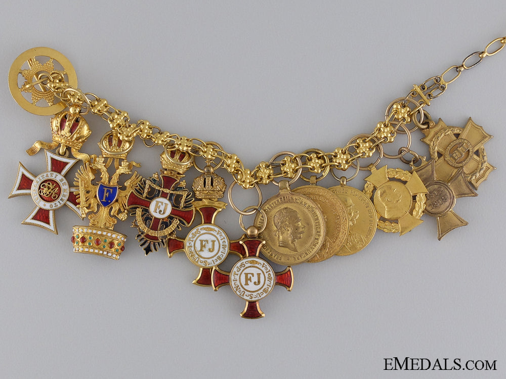 a_fine_set_of11_miniatures_on_a_gold_chain1900-1910_a_fine_set_of_11_53ff7f37ce831