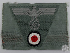 A German Em/Nco’s M43 Army Trapezoid Cap Insignia