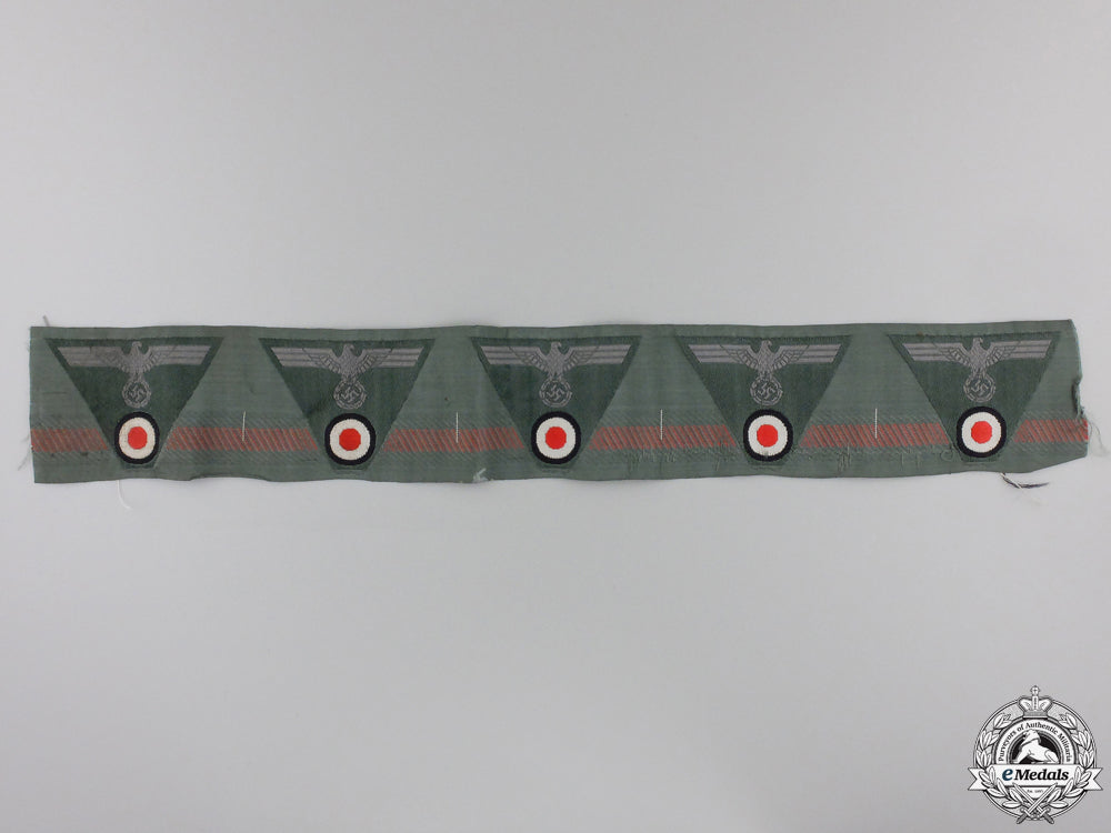 a_mint_strip_of_german_m43_trapezoid_cap_insignia_a_mint_strip_of__5550e1fac6b30
