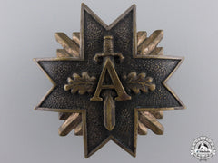 A Pre Second War Latvian Military Badge With Swords