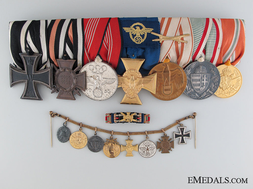 a_seven_piece_german_medal_bar_with_matching_miniatures_a_seven_piece_ge_5308e184c6dd1