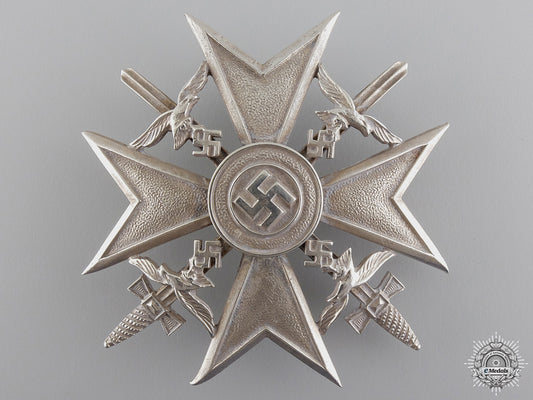 a_spanish_cross_in_silver_with_swords_by_c.e._juncker_a_spanish_cross__54ba773323019