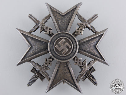 a_spanish_cross_in_silver_with_swords_by_meybauer,_berlin_a_spanish_cross__55b0f43c75dd6