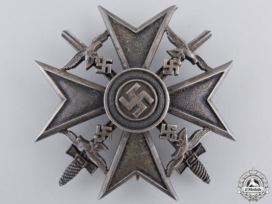 a_spanish_cross_in_silver_with_swords_by_meybauer,_berlin_a_spanish_cross__55b0f43c75dd6