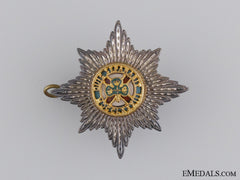 A Sterling Silver Irish Guards Officer's Cap Badge
