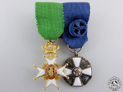 a_swedish&_finnish_miniature_pair_in_gold_a_swedish___finn_559c2a27da2f4