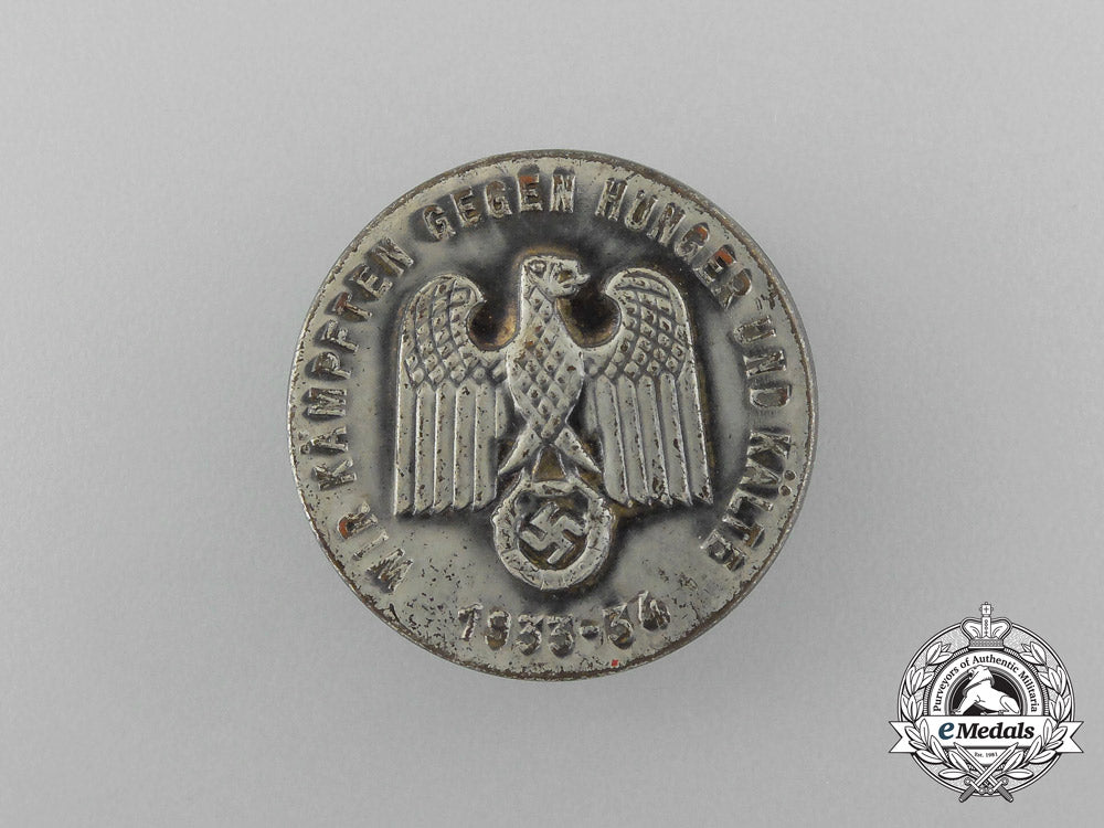 a1933/34_whw(_winter_relief_of_the_german_people)_donation_badge_aa_1479