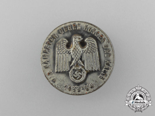 a1933/34_whw(_winter_relief_of_the_german_people)_donation_badge_aa_1479