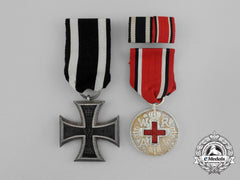 A First War Iron Cross 1914 &  Prussian Red Cross Medal Pair