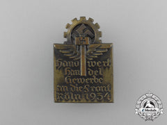 A 1934 Hago Cologne “Crafts, Trade, And Commerce As Top Priority” Badge