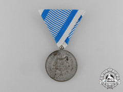A Yugoslavian Medal For Service To The Royal Household; Silver Grade