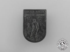 A 1940/41 WHW “Glow And Shine, Golden Sun, Over This Free Land” Badge