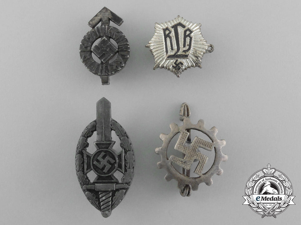 a_grouping_of_four_third_reich_period_badges_aa_2542