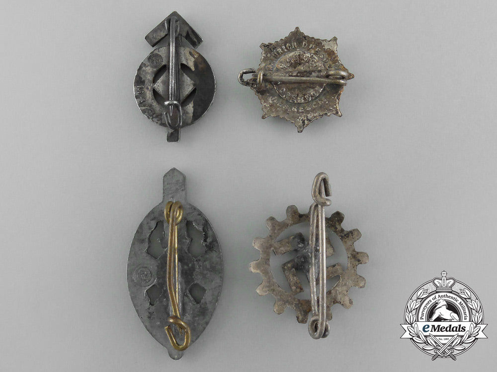 a_grouping_of_four_third_reich_period_badges_aa_2543