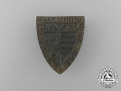 A 1938 German “70 Years Of German Gymnastics” Badge By C. Poellath