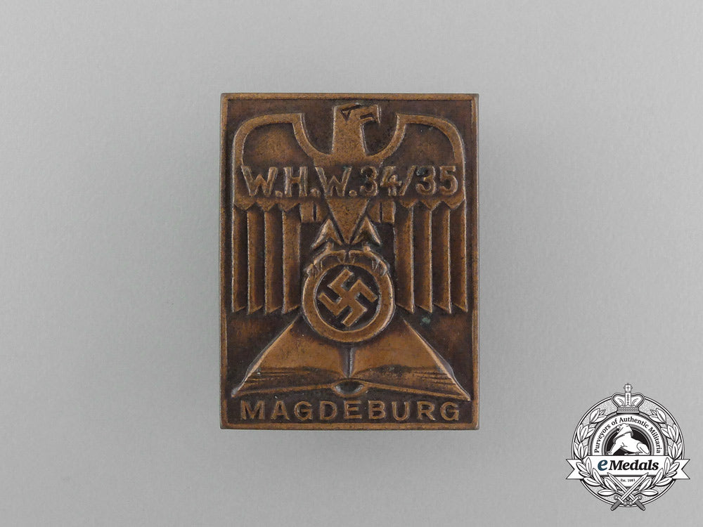 a1934/35_whw(_winter_aid_of_the_german_people)_magdeburg_donation_badge_aa_3944