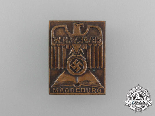 a1934/35_whw(_winter_aid_of_the_german_people)_magdeburg_donation_badge_aa_3944