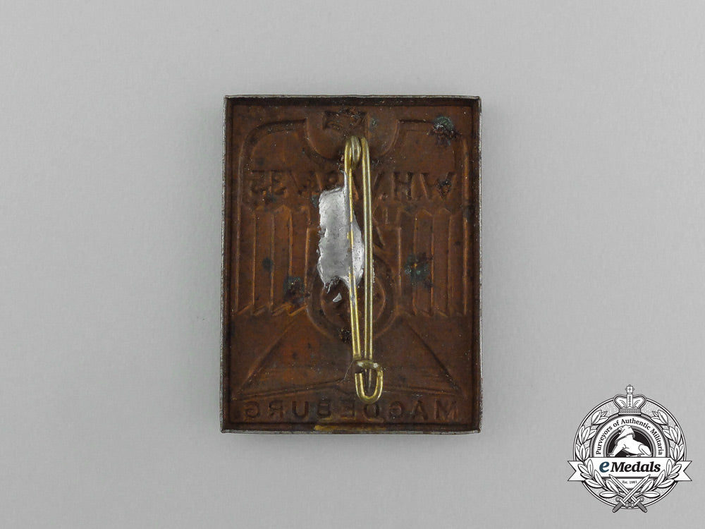 a1934/35_whw(_winter_aid_of_the_german_people)_magdeburg_donation_badge_aa_3945