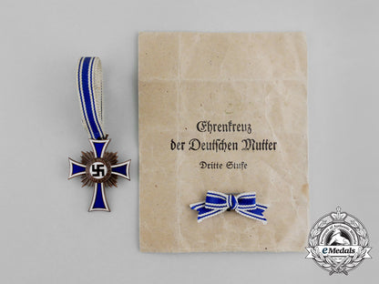 a_bronze_grade_cross_of_honour_of_the_german_mother_in_its_packet_of_issue_by_gebrüder_schmidt_aa_6490