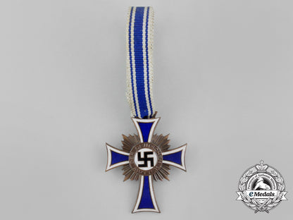 a_bronze_grade_cross_of_honour_of_the_german_mother_in_its_packet_of_issue_by_gebrüder_schmidt_aa_6491