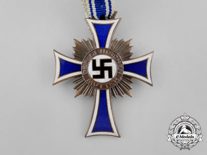 a_bronze_grade_cross_of_honour_of_the_german_mother_in_its_packet_of_issue_by_gebrüder_schmidt_aa_6492