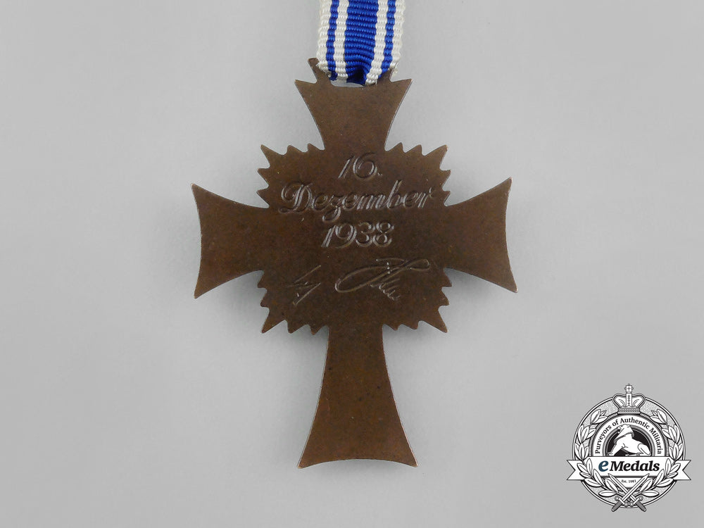 a_bronze_grade_cross_of_honour_of_the_german_mother_in_its_packet_of_issue_by_gebrüder_schmidt_aa_6493