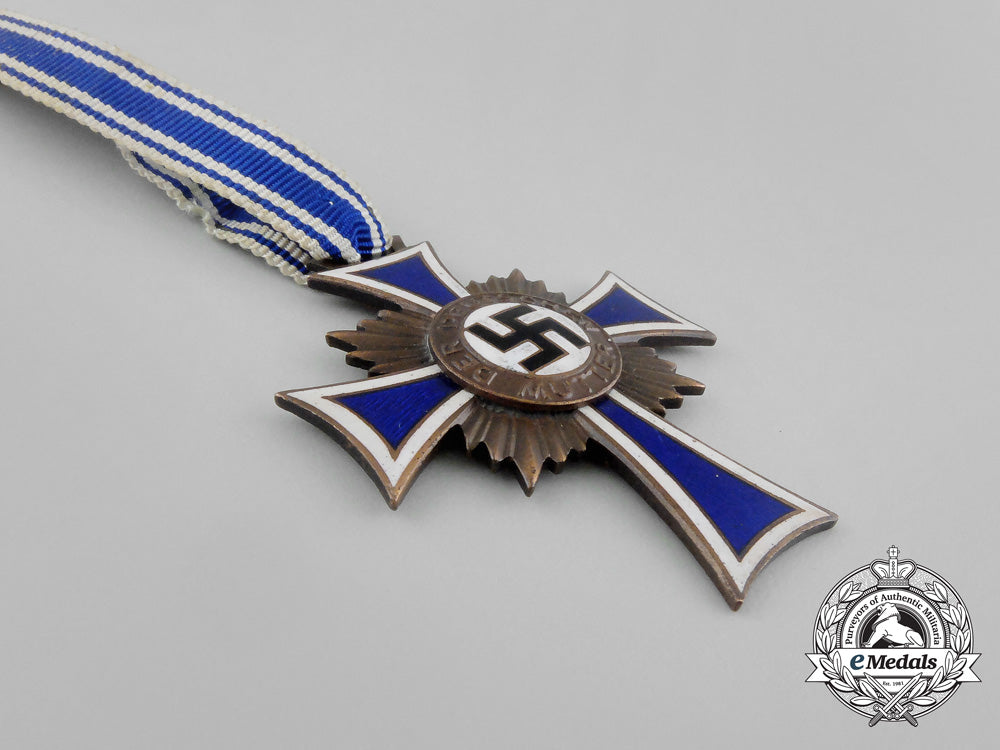 a_bronze_grade_cross_of_honour_of_the_german_mother_in_its_packet_of_issue_by_gebrüder_schmidt_aa_6494