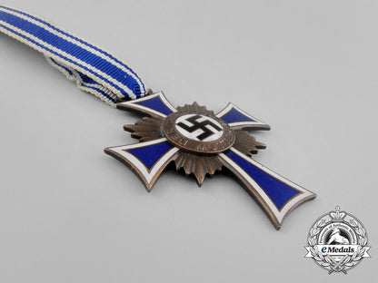 a_bronze_grade_cross_of_honour_of_the_german_mother_in_its_packet_of_issue_by_gebrüder_schmidt_aa_6494