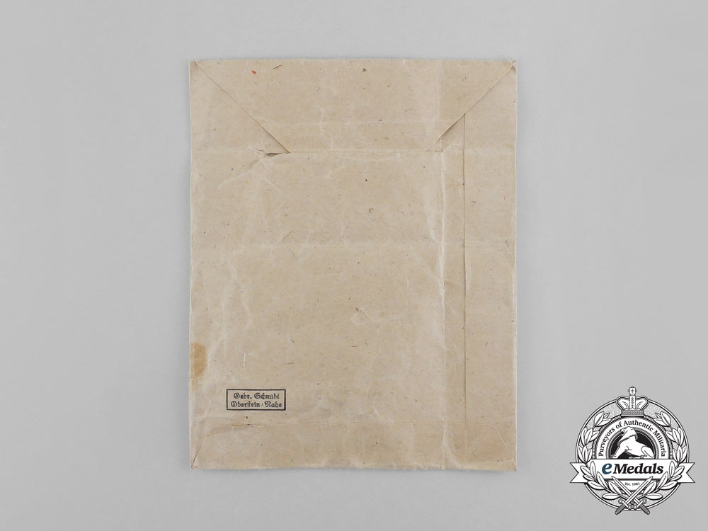 a_bronze_grade_cross_of_honour_of_the_german_mother_in_its_packet_of_issue_by_gebrüder_schmidt_aa_6495