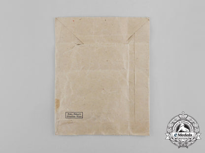 a_bronze_grade_cross_of_honour_of_the_german_mother_in_its_packet_of_issue_by_gebrüder_schmidt_aa_6495