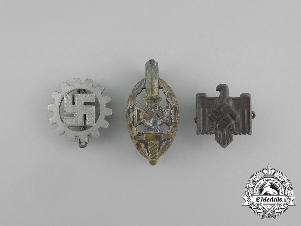 a_grouping_of_three_second_war_german_membership_badges_aa_6514