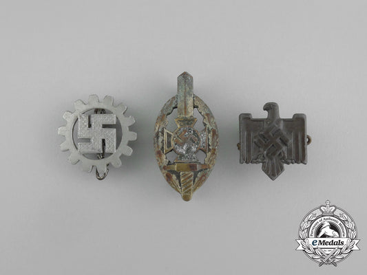 a_grouping_of_three_second_war_german_membership_badges_aa_6514