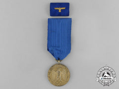 A Wehrmacht 12-Year Long Service Medal With Matching Boutonniere And Ribbon Bar